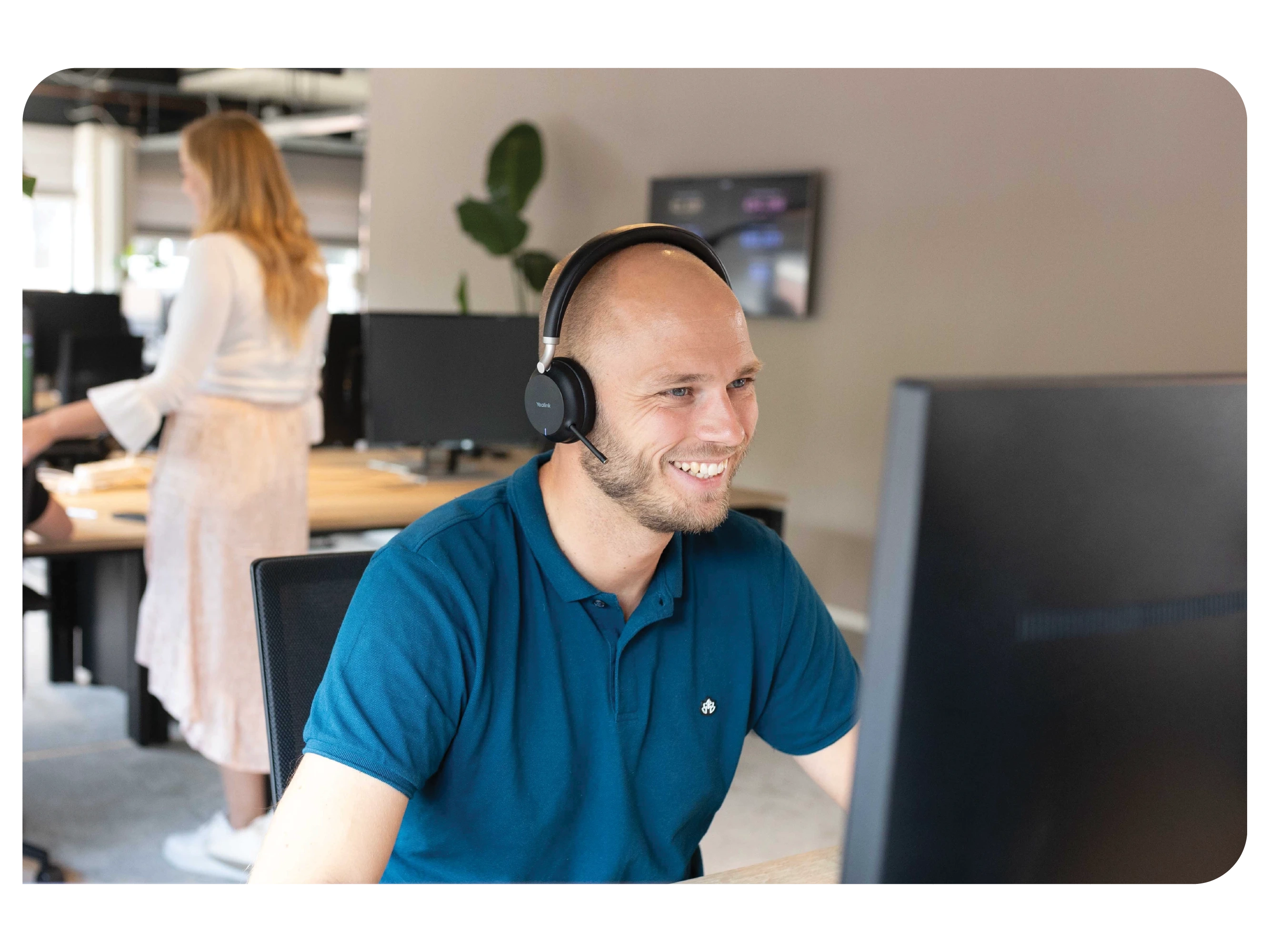 An employee making a call to a client.