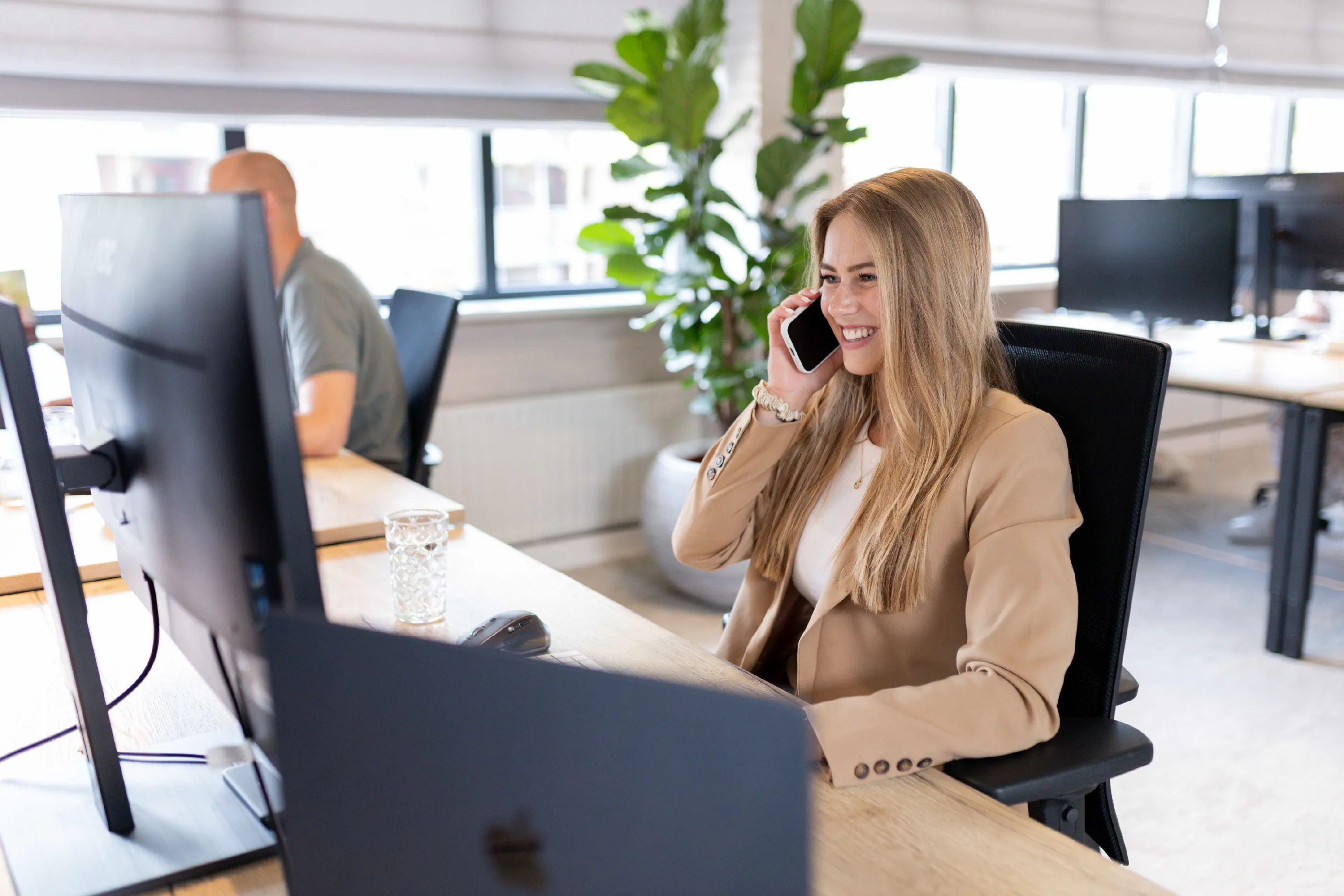 Image of a vPlan employee providing phone support and advice to a vPlan Enterprise customer.